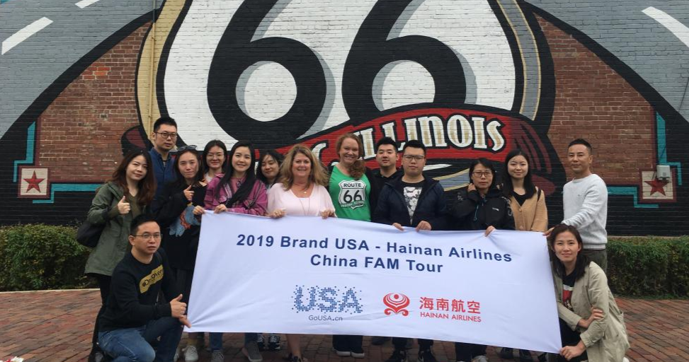 A Chinese FAM tour in front of the Route 66 mural in Pontiac.